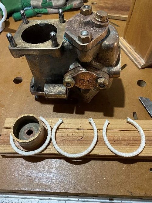Cooling water pump with new packing rings cut ready to reassemble