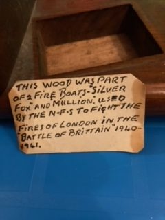 Note inside book ends using wood from fireboats Silver Fox and Mullion